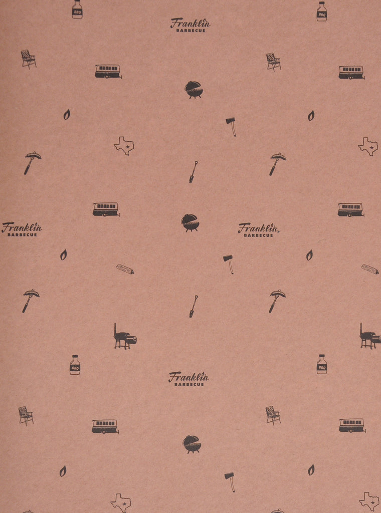 Close up view of the unrolled pink butcher paper. A pattern of barbecuing/grilling items and the Franklin Barbecue logo are printed in black.